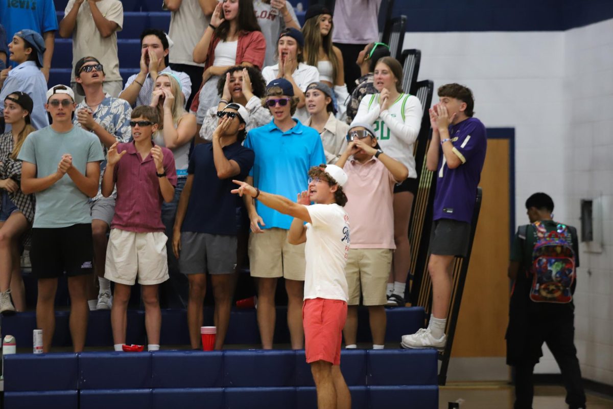 The student section yells while Staunton serves. 