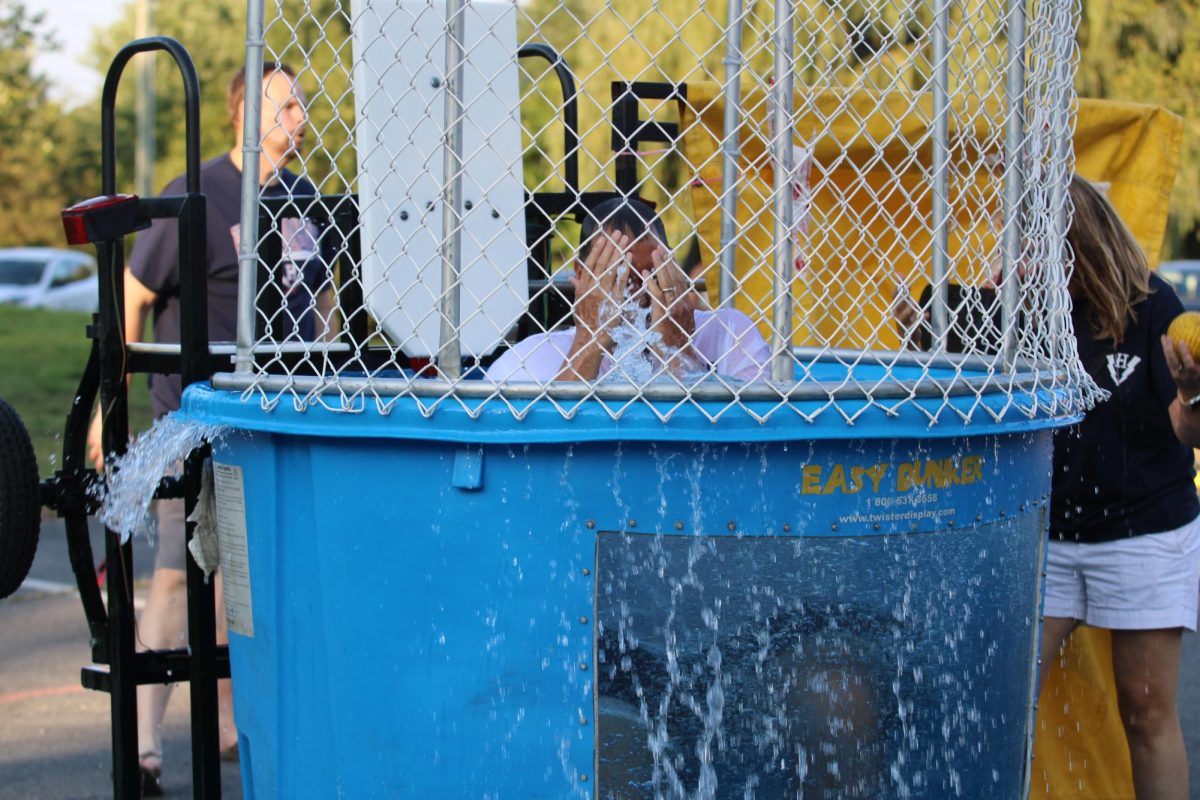 Dean of Students Don Burgess falls into the dunk tank.