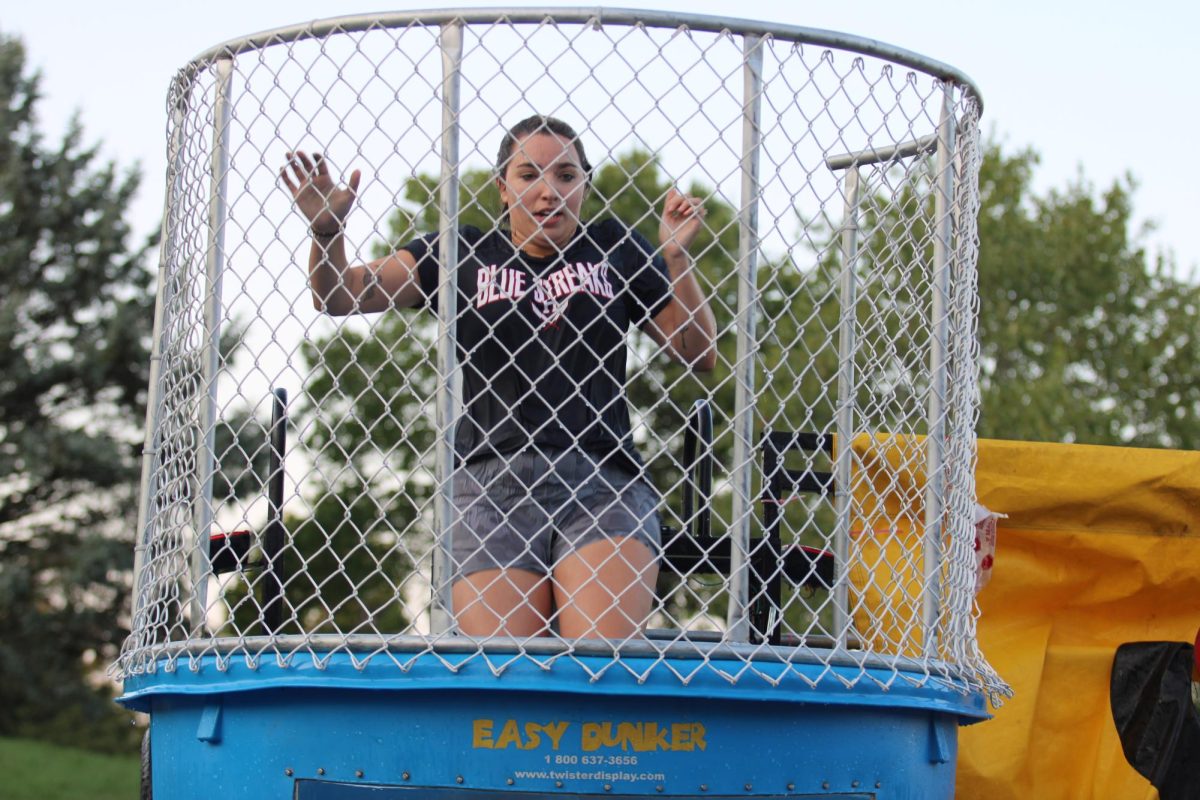 SCA sponsor Anna Henkel falls into the dunk tank.