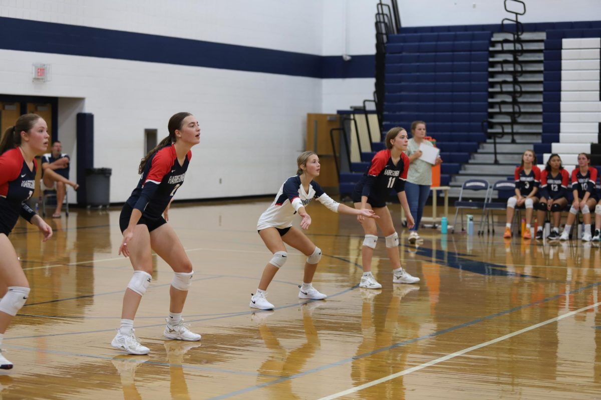 The backrow prepares for a serve from Staunton's volleyball team.