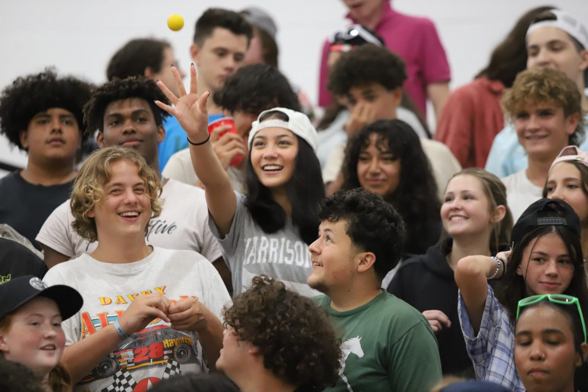 The student section played cup pong while dressed in frat attire for the frat theme. 