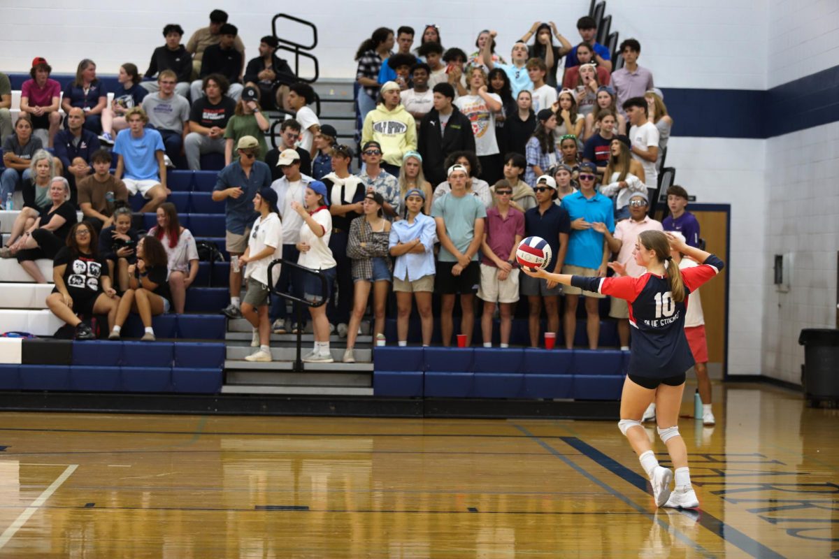 Senior Macy Waid prepares to serve against the Staunton Storm.