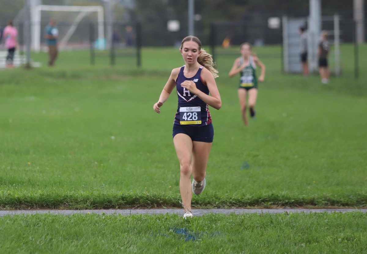 Junior Abby Gibson gets ready for her last dash at the end of her first home meet.