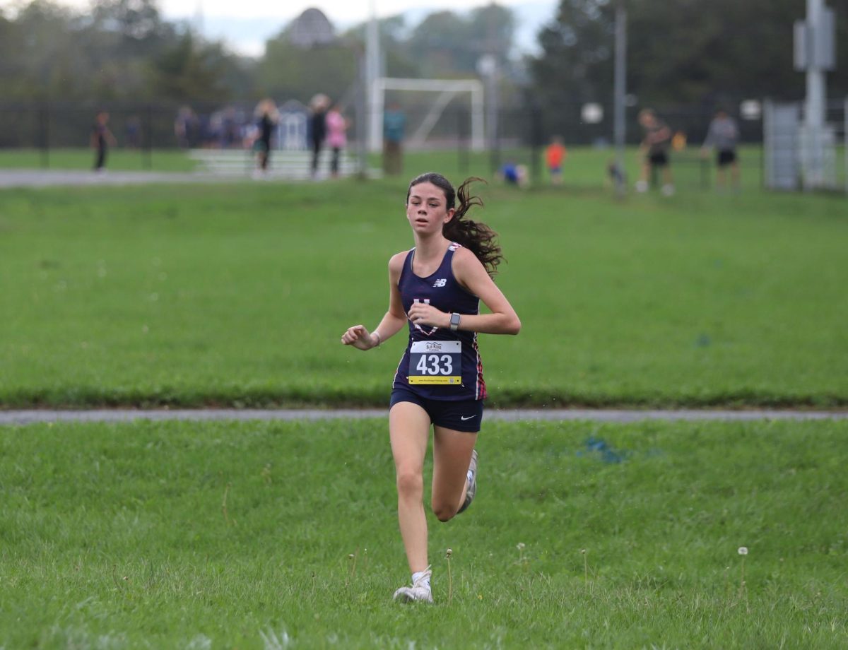 Sophomore Brooke Saunders races to the finish line at Thomas Harrison.