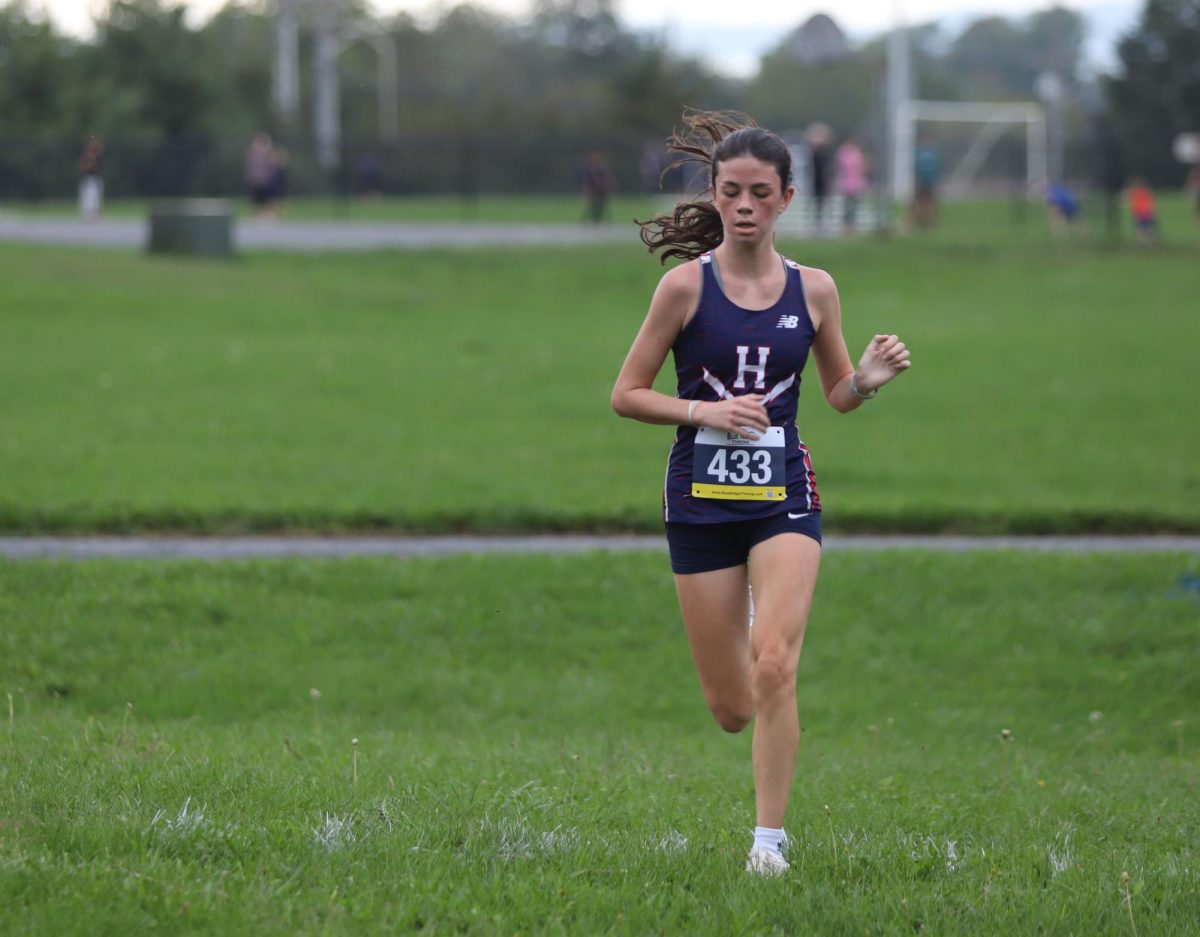 Sophomore Brooke Saunders focuses on crossing the finish line after her race.