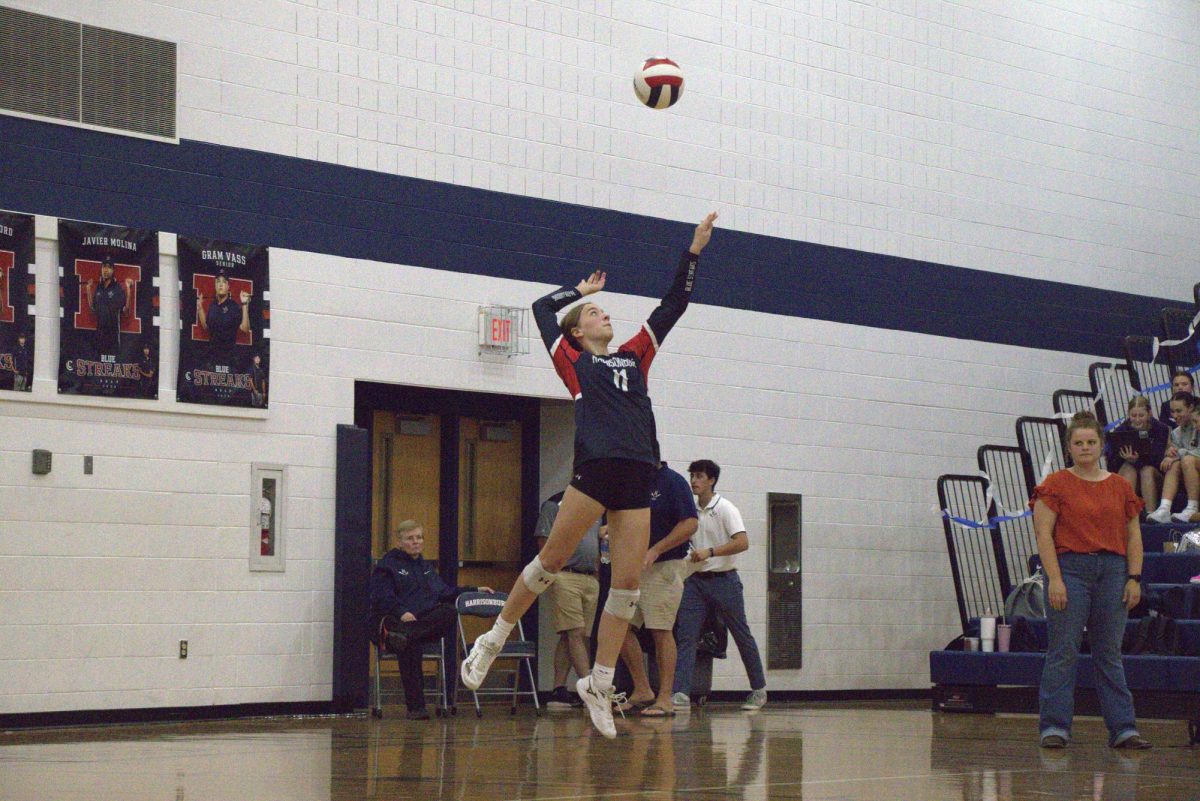 Freshman Maren Bert serves the ball and brings the team one step closer to victory. 