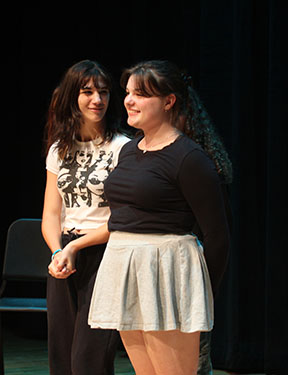 Junior Hazel Pinnow looks at the crowd during the improv show performance.