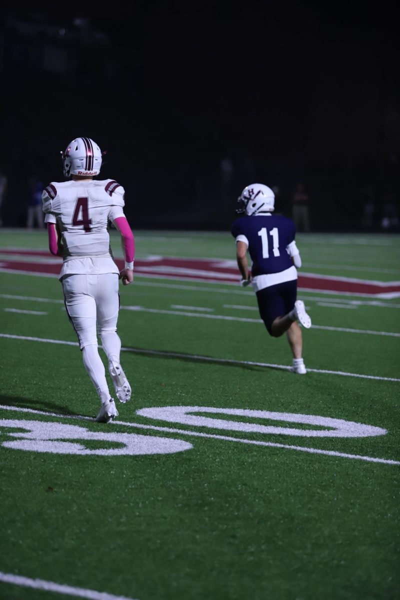 Junior Fernando Rodriguez running toward the play to make the tackle.