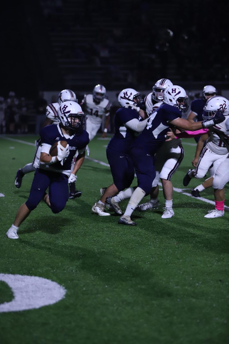 Junior Fernando Rodriguez running the ball on offense.
