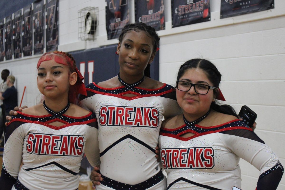Captain of the JV cheerleading squad and her teammates taking a picture to celebrate their victory. HHS JV Cheer team won 2nd place and varsity won 3rd.