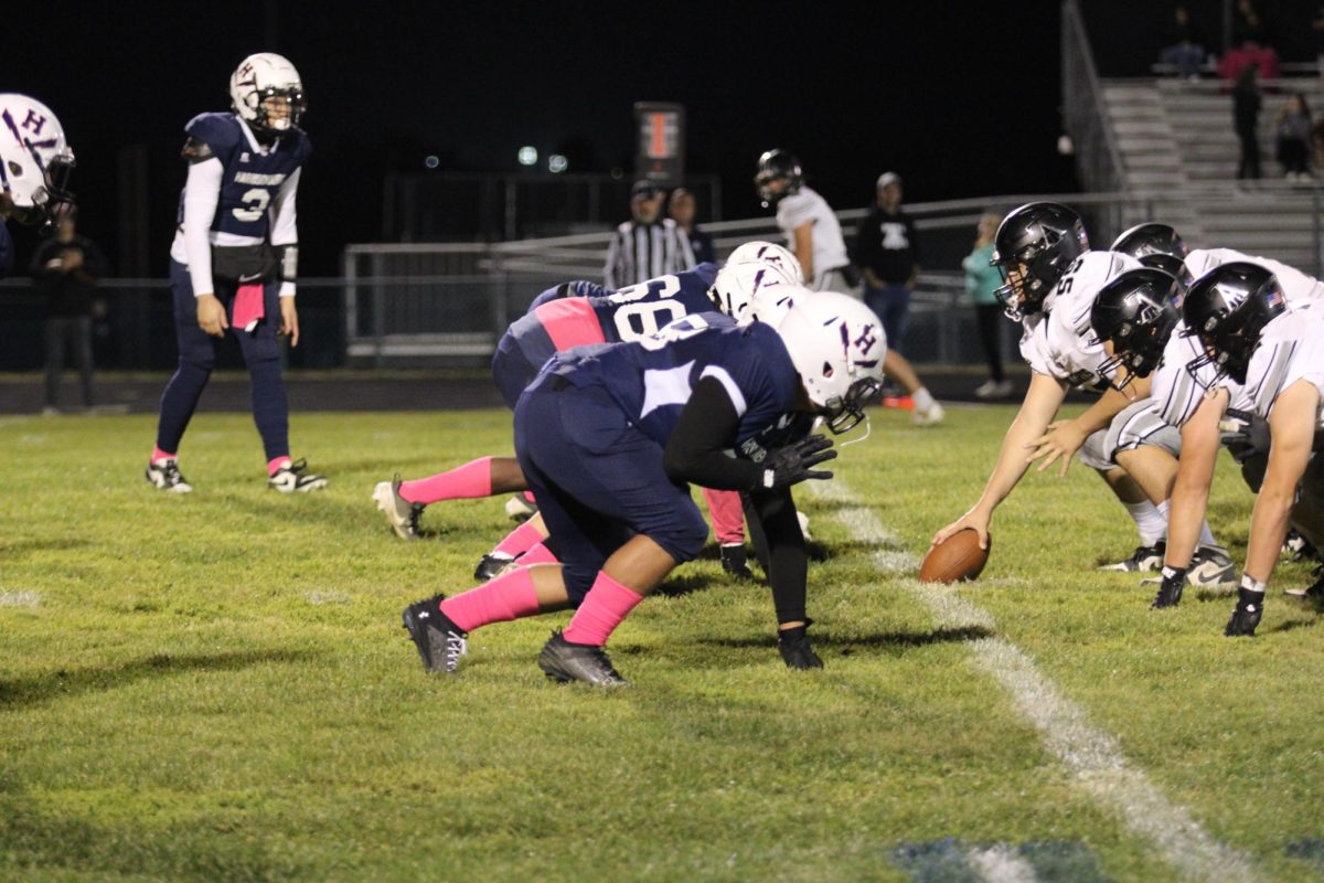 The Blue Streaks defensive line sets up to go after the Knights quarterback.