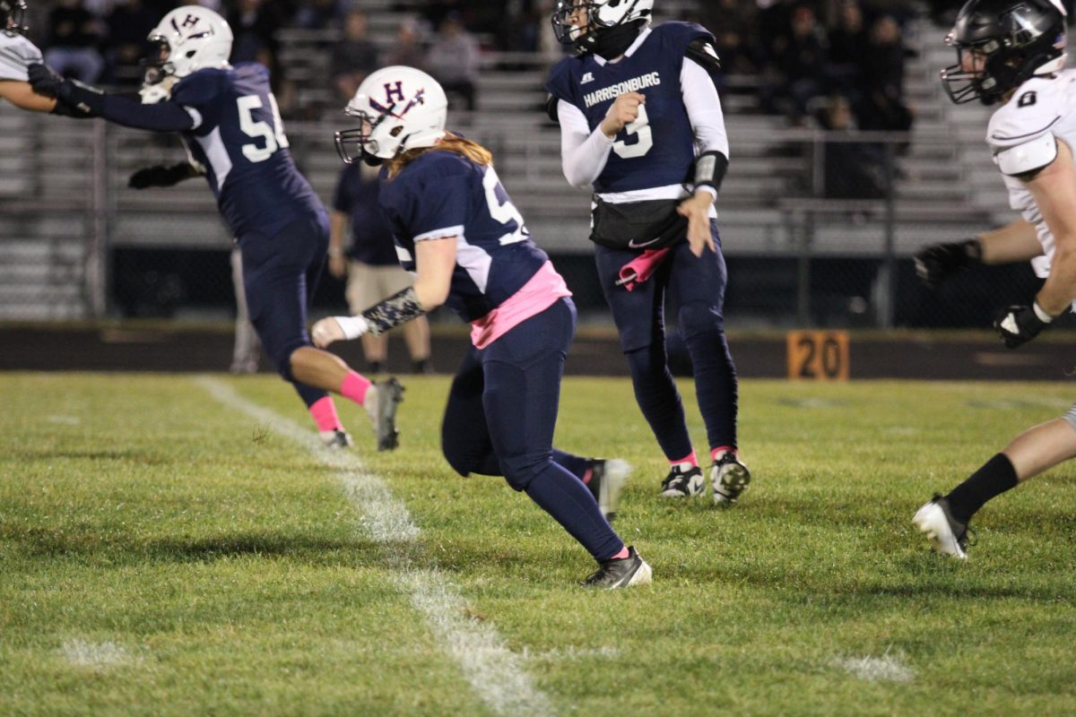 Sophomore Ava Colley runs at the Knights offense to make a tackle.