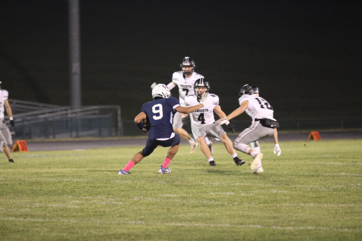 Senior Filip Toelau fakes out multiple Knights defenders.