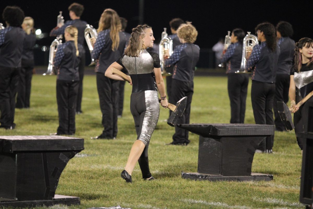 Junior Annie Snow dances in colorguard. 