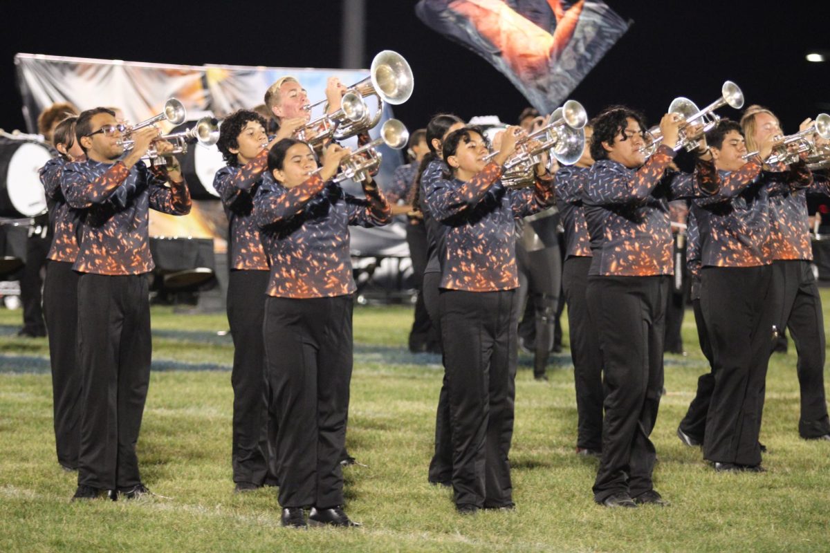 The trumpets walk in formation. 