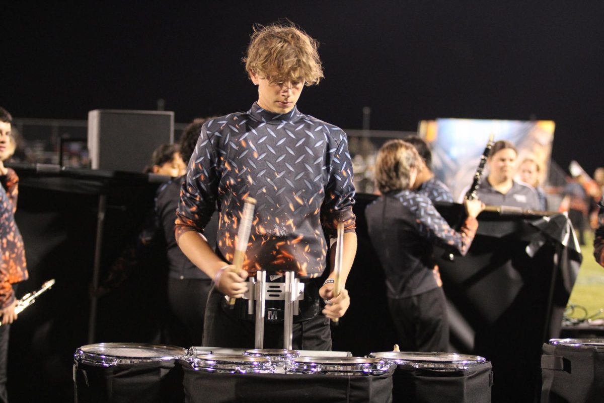 Eli Long plays the drums after the show. 