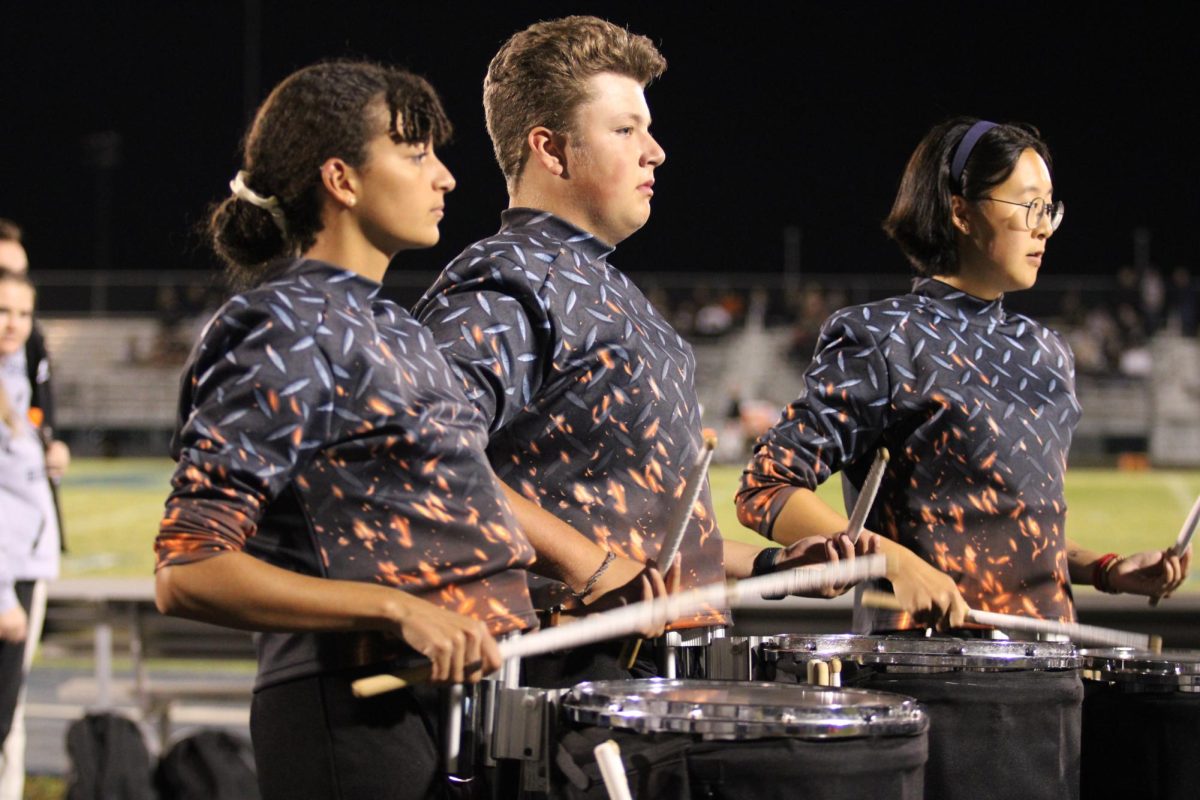 Eliza Malcom and Gram Vass play the drums after the halftime show. 