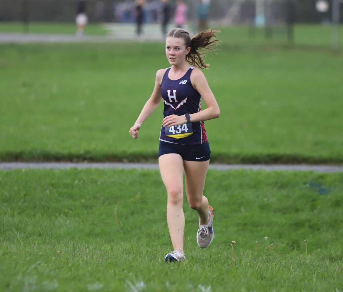 Freshman Katie Witmer takes her last steps before finishing the home race at Thomas Harrison.