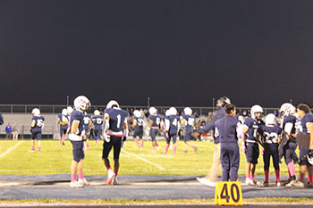 Football players watching the game