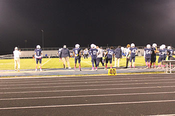 Football players waiting to go on the field