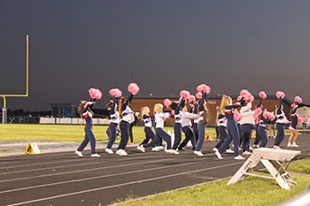 Sideline cheerleaders cheering for our Blue Streaks varsity team.
