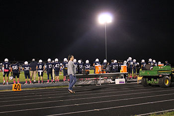 Football players patiently waiting.