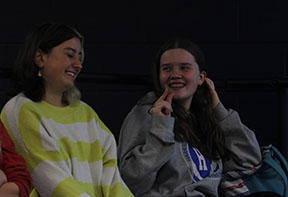 Juniors Reece Tibbles and Abbie Bloss talk while waiting for the performance to start.