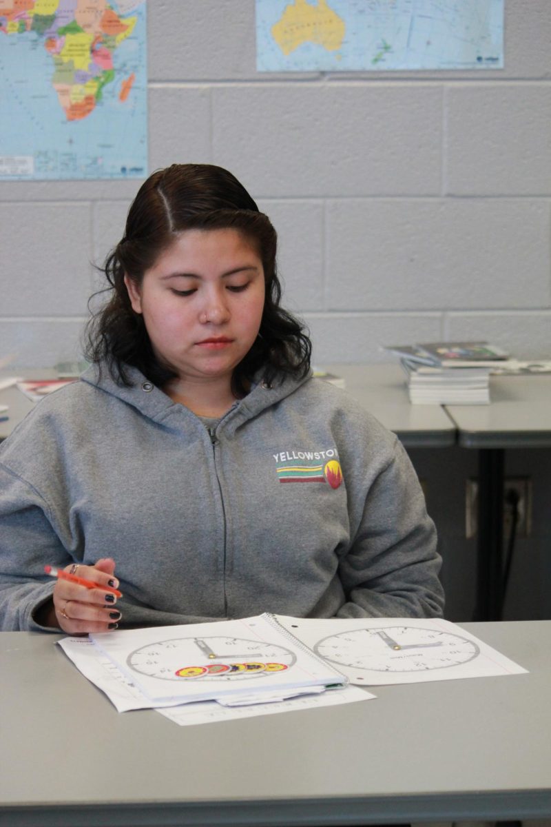 Genesis Gonzaloz focused on her clock