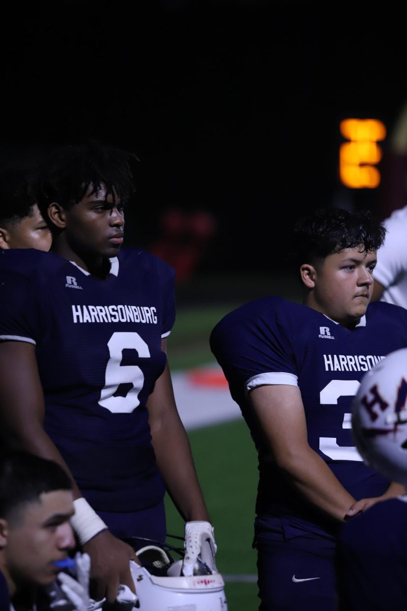 Joel Friebe and Adan Romero Castaneda listening to the coaches speech at halftime.