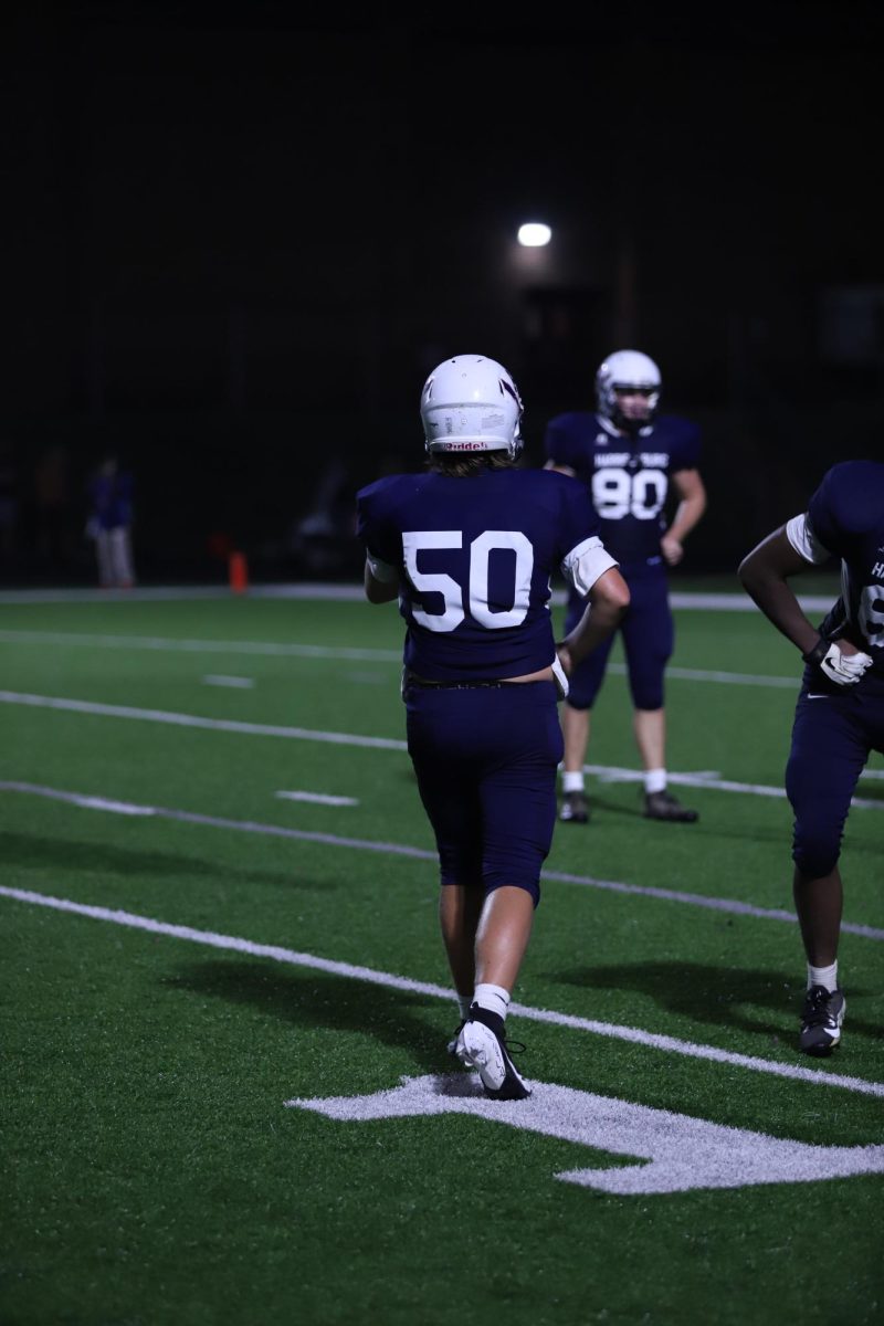 Freshman Reuben Miller getting on the field after halftime.