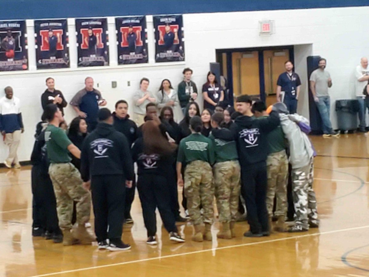 HHS JROTC huddle together.