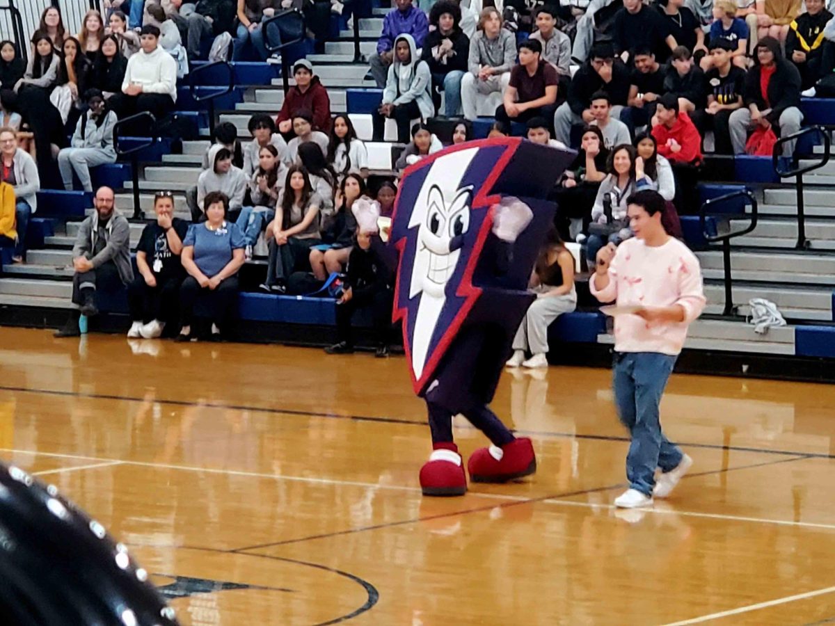 Our mascot, Bolt, runs out and greets everyone on the bleachers.