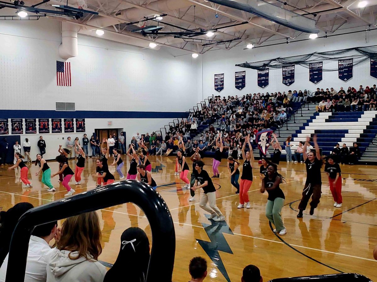 HHS dance performs, facing towards the Junior and Seniors.