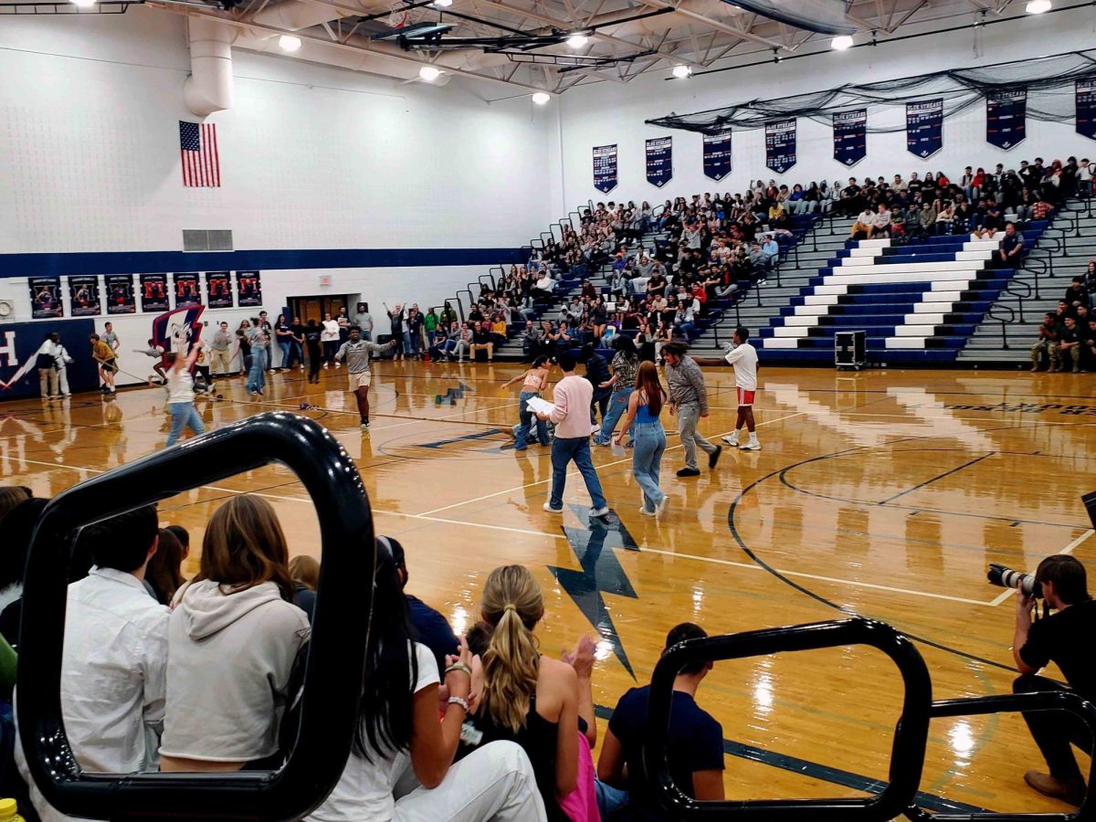 Juniors celebrate as they win the game of tug-of-war.