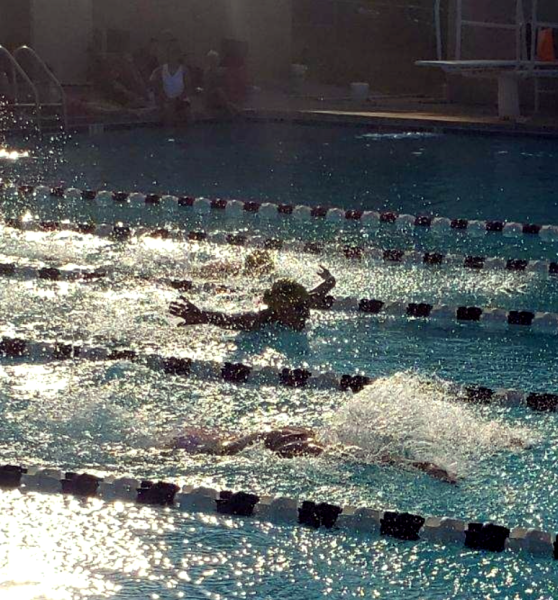 Sophomore Katie Grace Schwartz swims at a Summer Swim Meet.