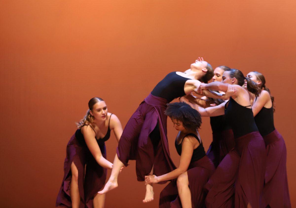 Dancers lift up senior Lydia King in senior Aiyana Thornton's piece "In the End."