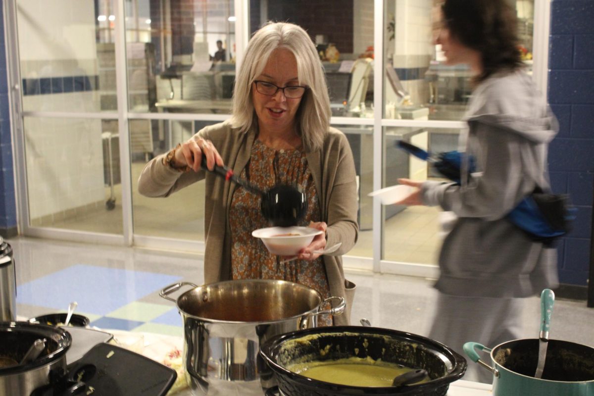 HHS teacher Ms.Cummings trying her favorite soup pozole.