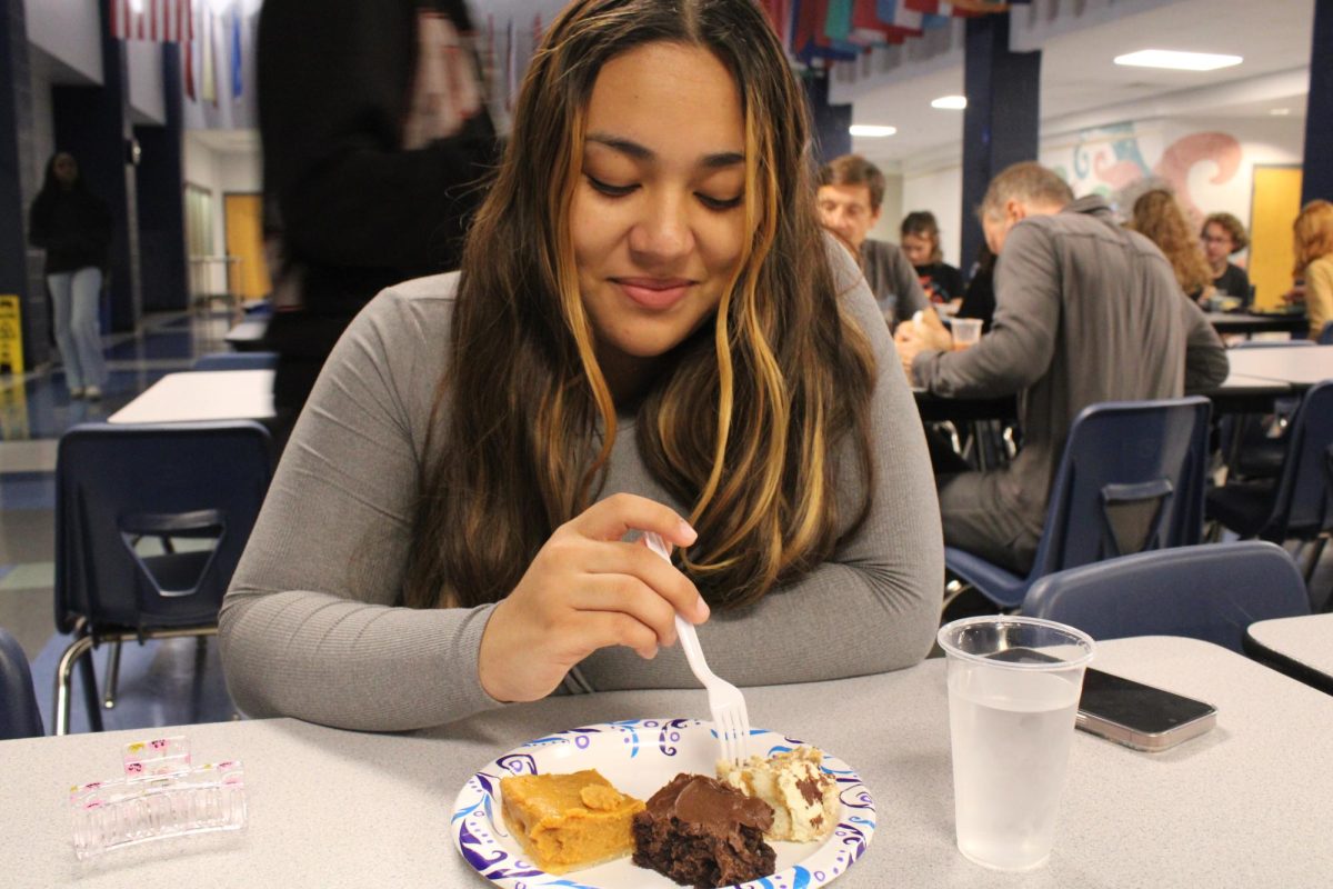 Suany Matute tries different types of pastries.