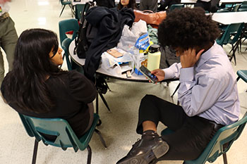 Green and Hernandez-Cubas strategize for Public Forum.