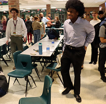 Green and Crigger grabbing their things to leave after the awards.