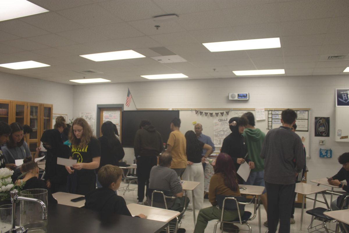 Group of students working together to build pyramids