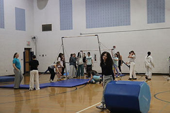 The girls are setting up The bar for practice. They spent awhile trying to tighten the bar this is also one of the first setting up the bar. "This was very confusing on what we were doing I have never set a bar up before" Hoover said.