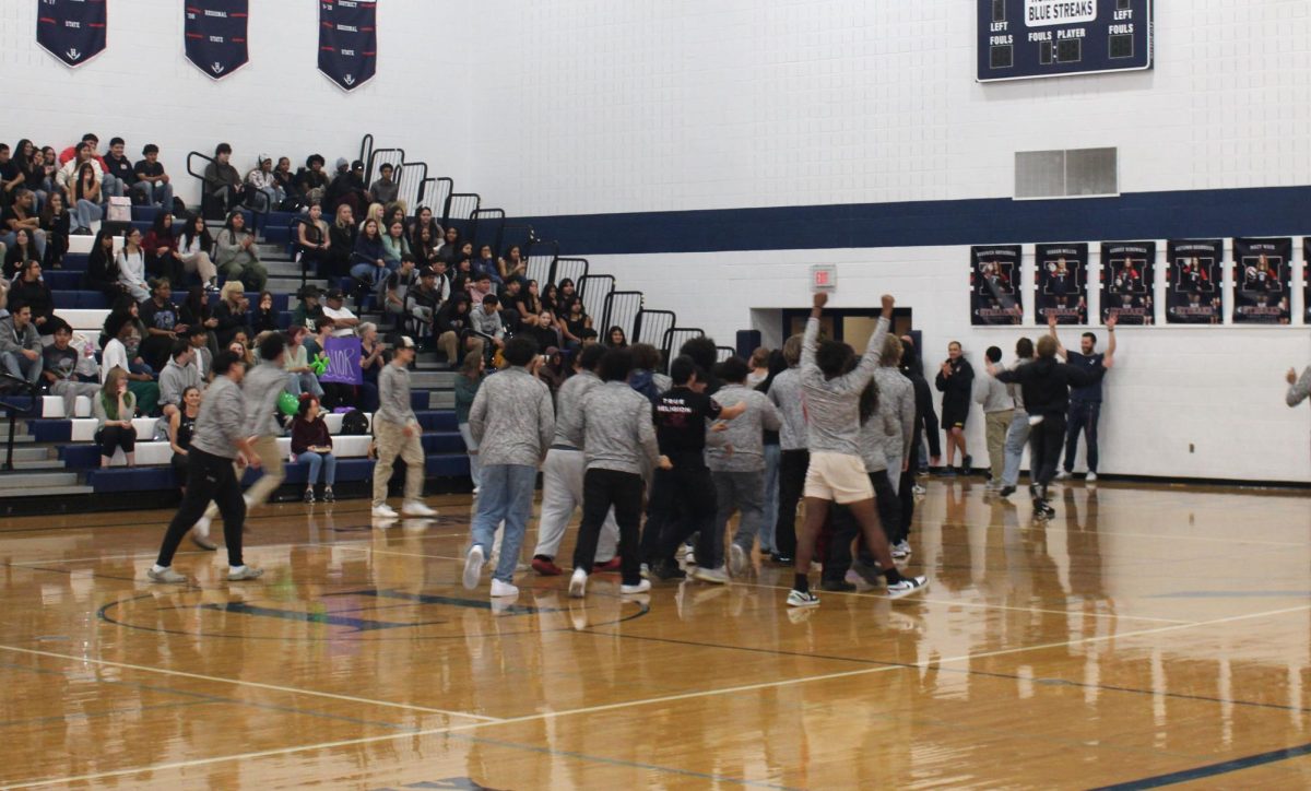 In the Pep Rally on Nov. 8th at Harrisonburg High School, we were introducing the clubs and sports that are directed in the school. We introduced the Basketball players, who ran into the gym and shot a ball in one of the four basketball hoops. They were a decently large group of players who have dedicated their lives to basketball.