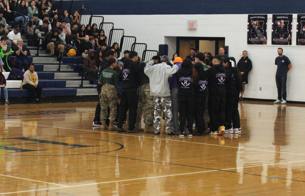 The Pep Rally in Harrisonburg High School’s gym initiated our sports, and clubs. One of the very groups was our Officers Club for students who would like to know and train for the military. They get introduced and then begin their short, professional act or performance. After they were finished the students and teachers in the stands cheered as loud as possible for them. Even if it was short, Harrisonburg High School still appreciated the show.