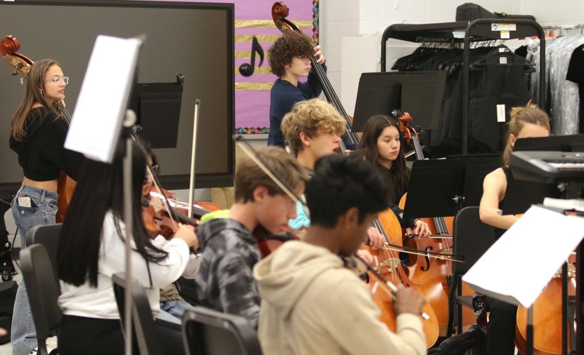 HHS orchestra rehearse. They were being conducted by Brian Incheck. "I am very excited for our new music for our Christmas concert," said Freshman Ava Thompson.