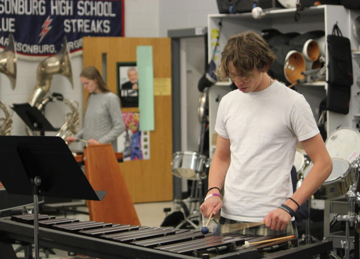 Junior Eli Long practices for the Holiday Assembly.