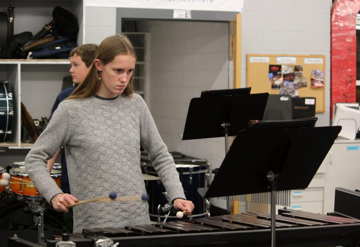 Senior Ellie Wiley focuses on playing the arrangement.