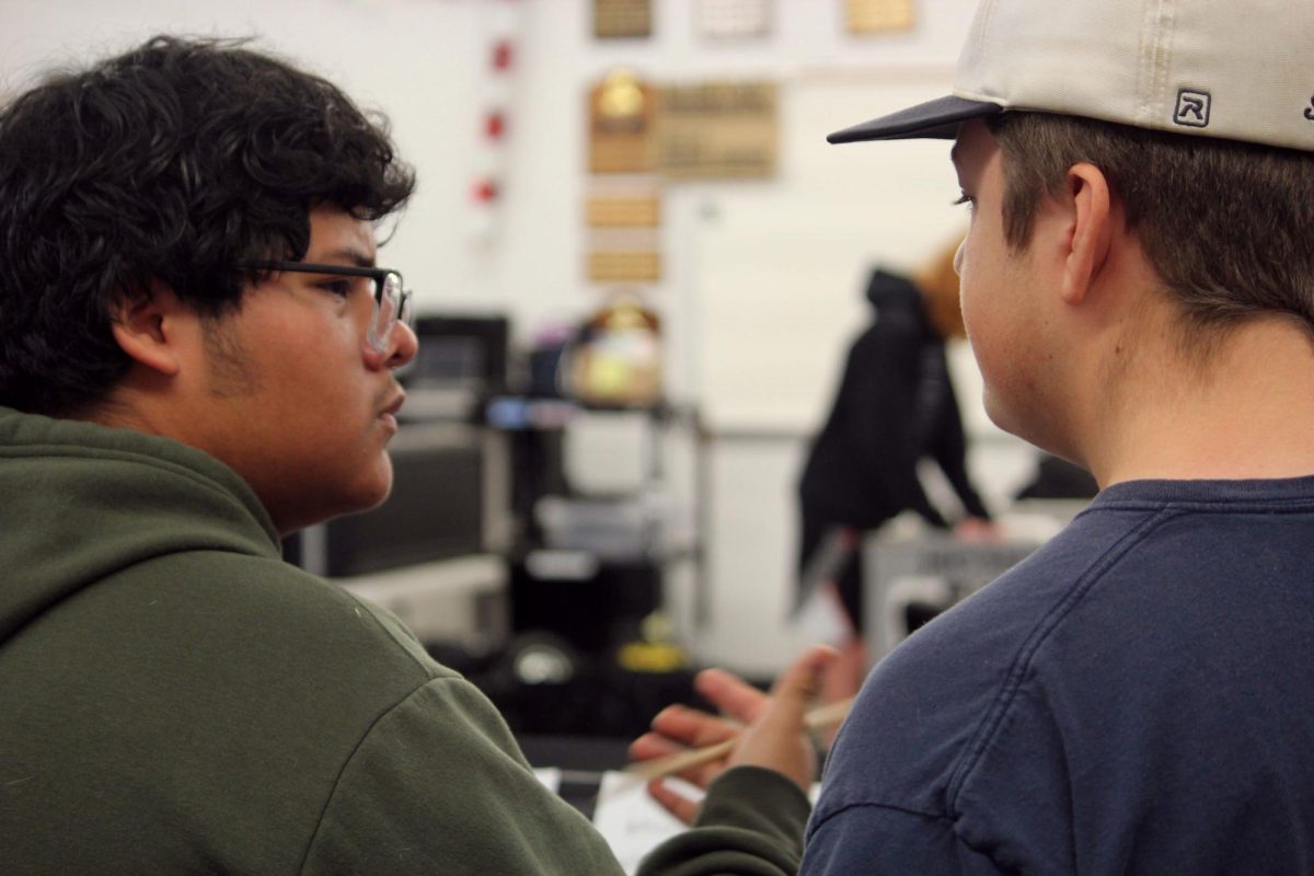 Students Frankie and Gram work together to understand the music.