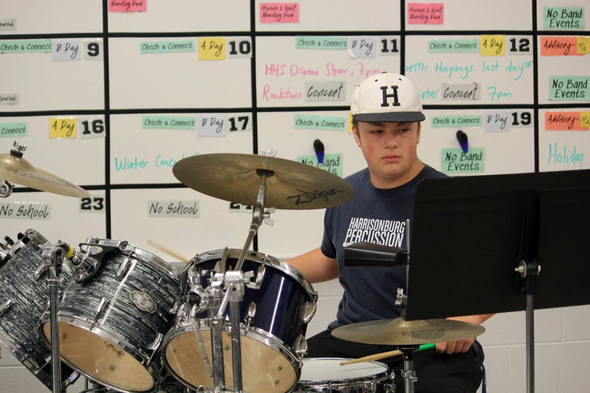 Gram Vass shows his talent on the drum set.