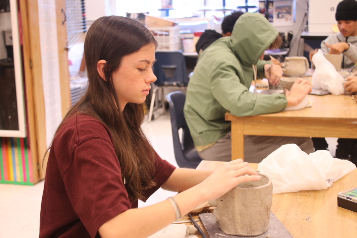 Sophomore Brooke Saunders work on making her sculpture perfect.